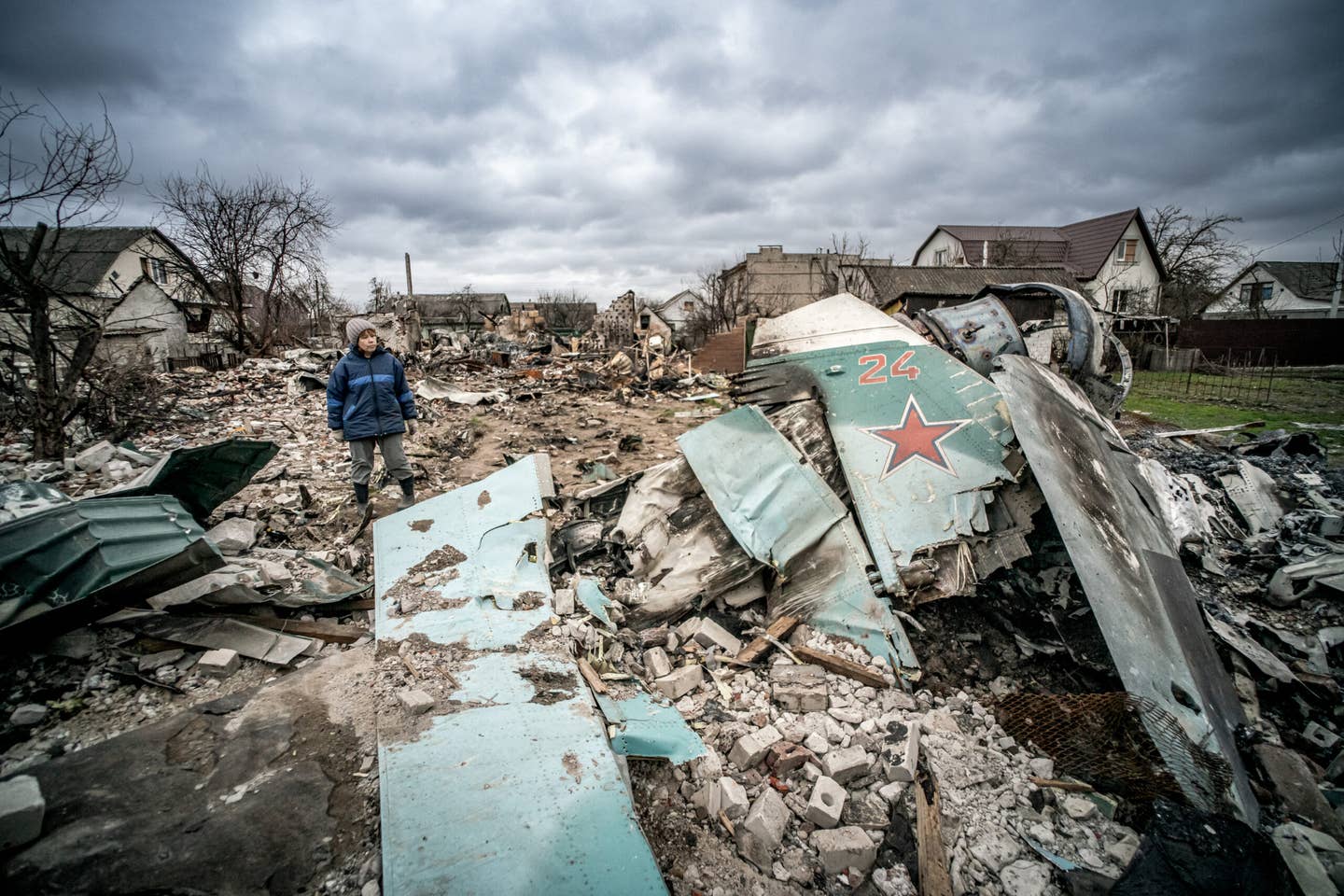 The wreckage of a Su-34 claimed shot down by Ukrainian air defenses crashed in a residential area of Chernihiv. <em>Photo by: Nicola Marfisi/AGF/Universal Images Group via Getty Images</em>